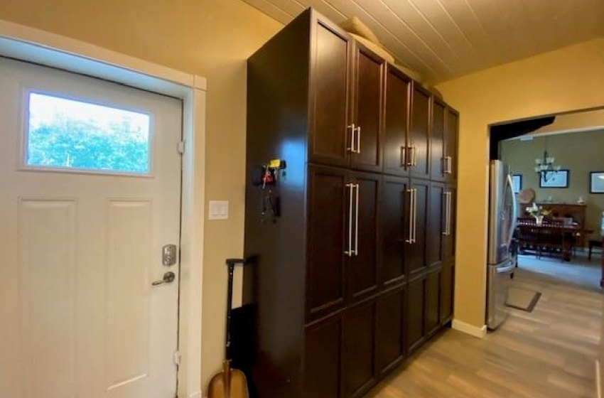 North entrance with full storage cabinetry