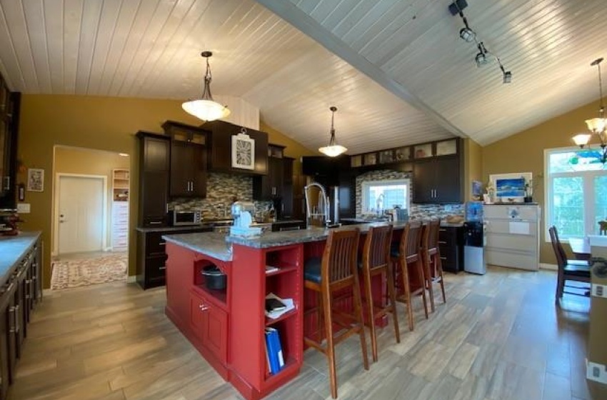 Kitchen island with raised eating/lounging area