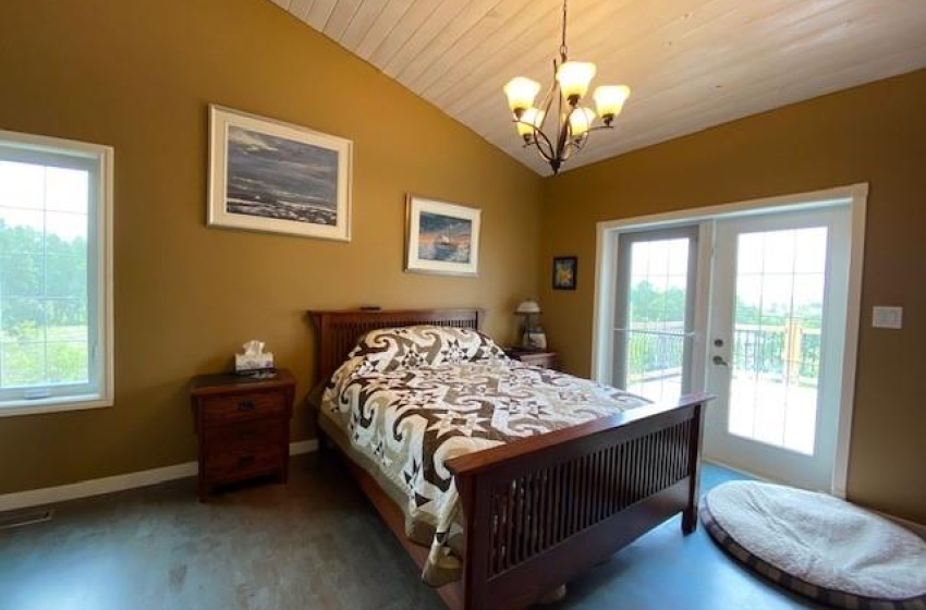 Master bedroom with patio doors to a 1000 sq ft deck