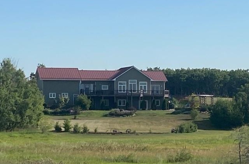 Full view of a 1740 sq ft home with attached triple car garage