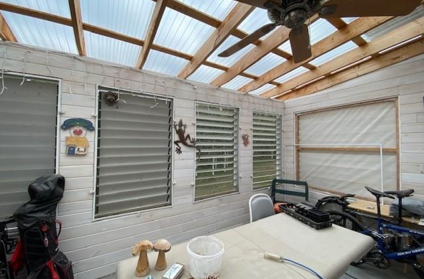 North side enclosed sunroom with loovers