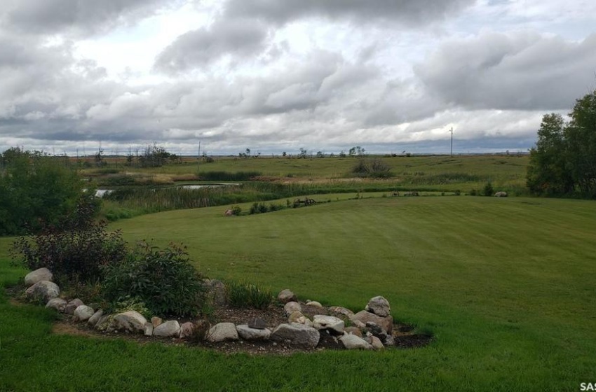 acres of beautiful grassland trimmed with flower beds