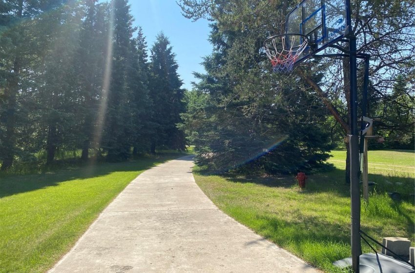 concrete driveway heading away from house