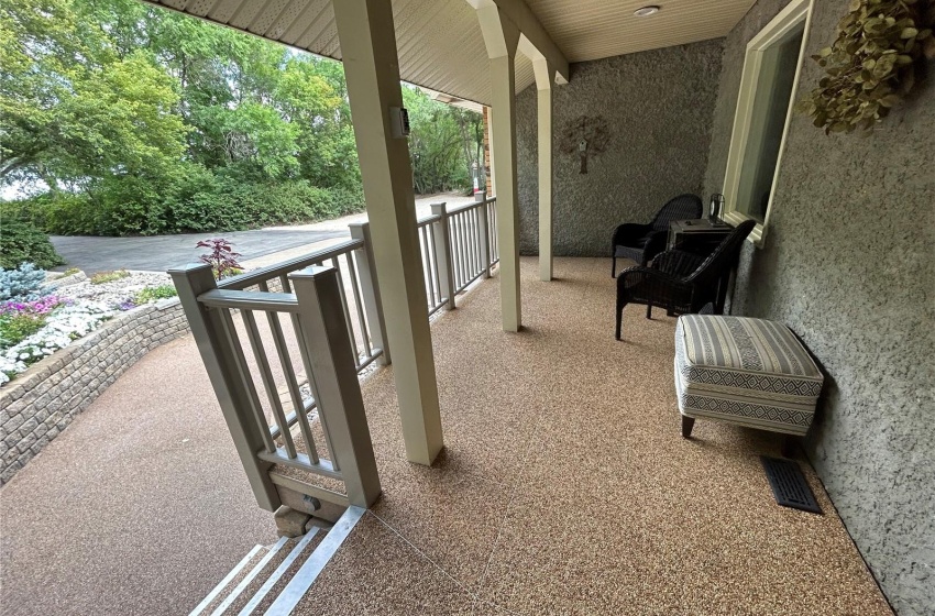 Huge front veranda. Finished with NatureStone & low-maintenance railing