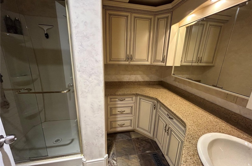 Main level Bathroom. Note matching kitchen cabinetry