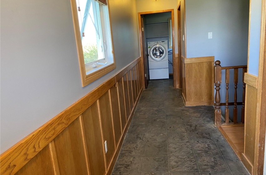 Front door foyer - closet to the left, laundry, 3 pce bath beyond.