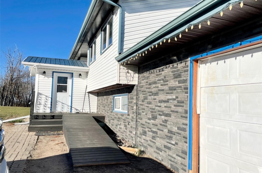 Attached garage has gravel floors