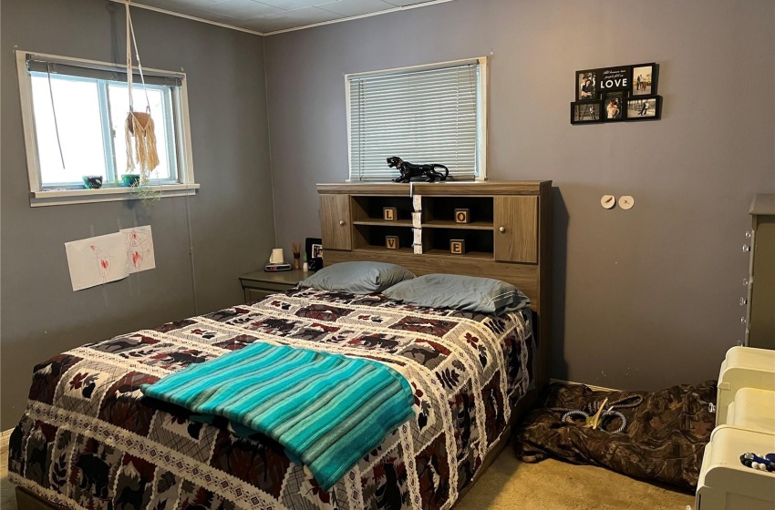 Bedroom with light colored carpet