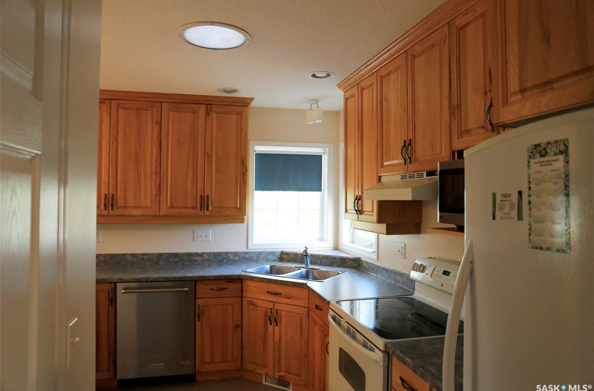 Kitchen featuring appliances with stainless steel finishes and sink