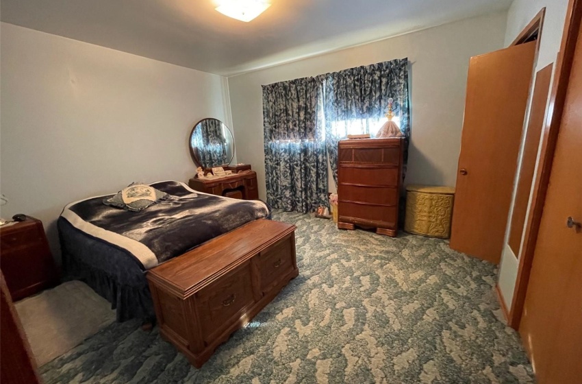 Bedroom with light colored carpet