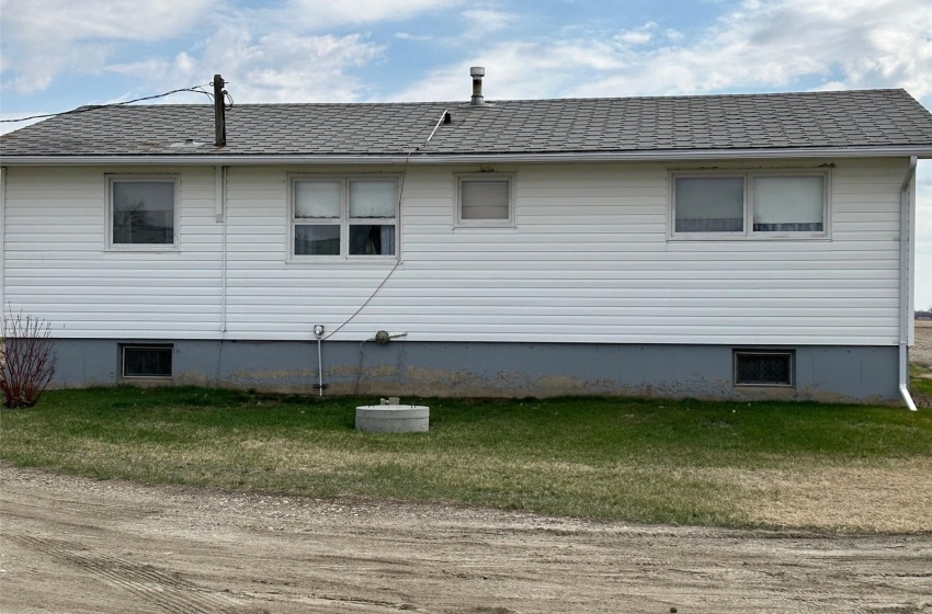 View of property exterior featuring a lawn