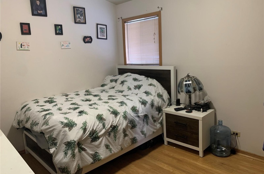 Bedroom with light hardwood / wood-style floors