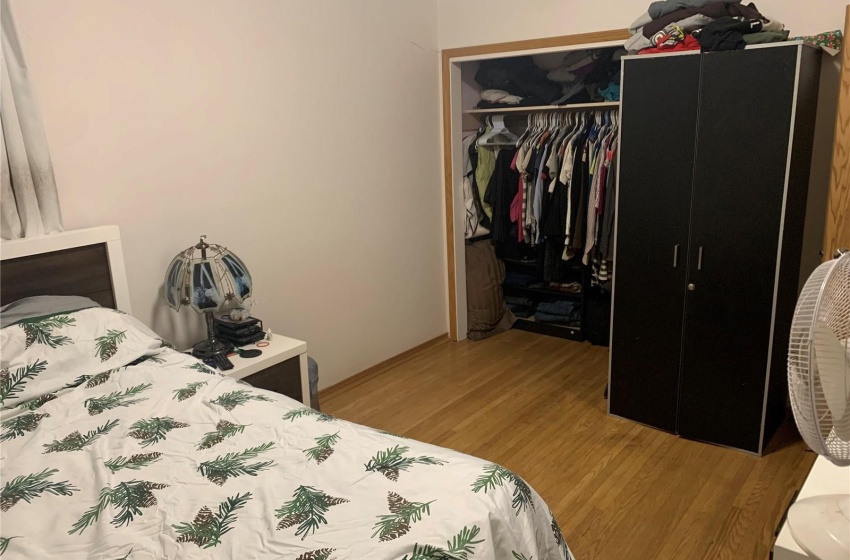 Bedroom featuring light wood-type flooring and a closet