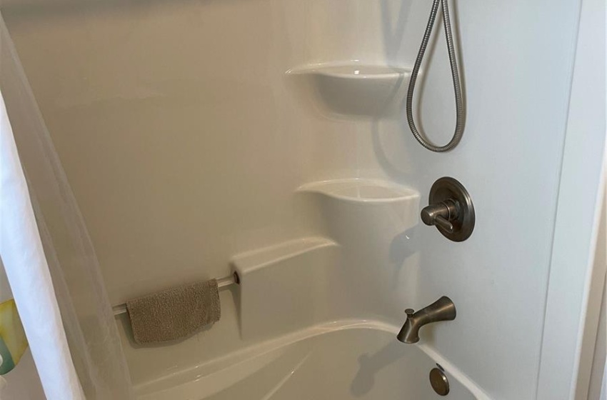 Bathroom featuring shower / tub combo with curtain