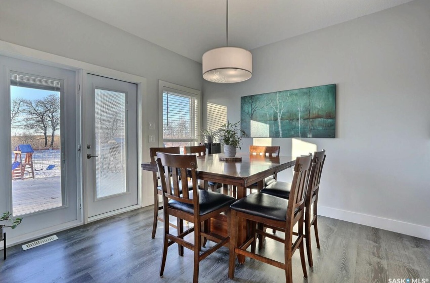 Dining area featuring dark hardwood / wood-style floors and plenty of natural light