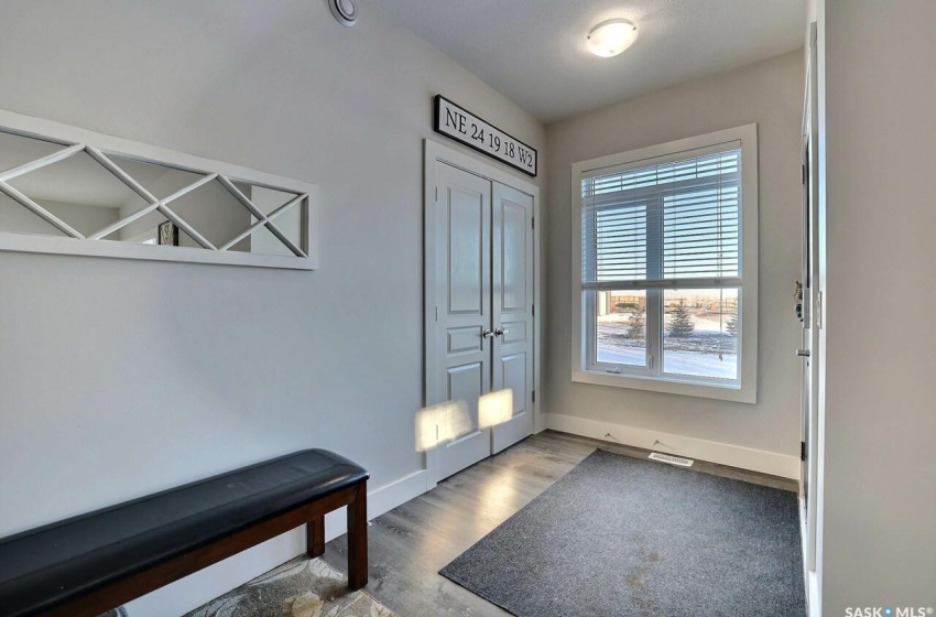 Doorway featuring light wood-type flooring