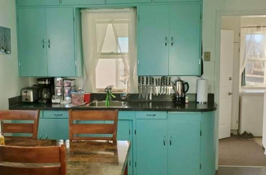 Kitchen featuring sink and blue cabinetry