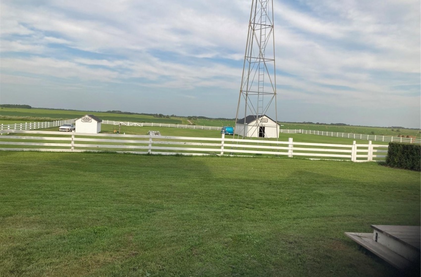 View of yard with a rural view and an outdoor structure