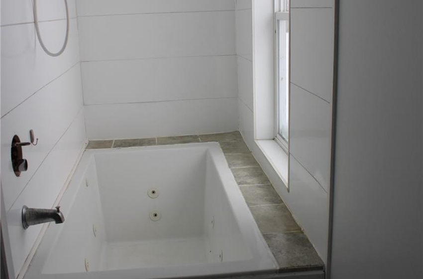 Bathroom featuring toilet and shower / bath combination