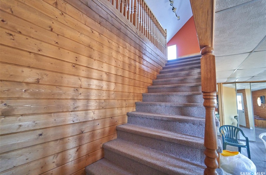 Stairs with a paneled ceiling