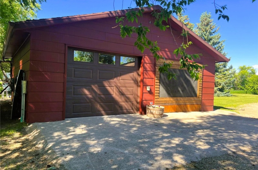 View of garage, Homeowner has a screen that be removed for garage door use if required.