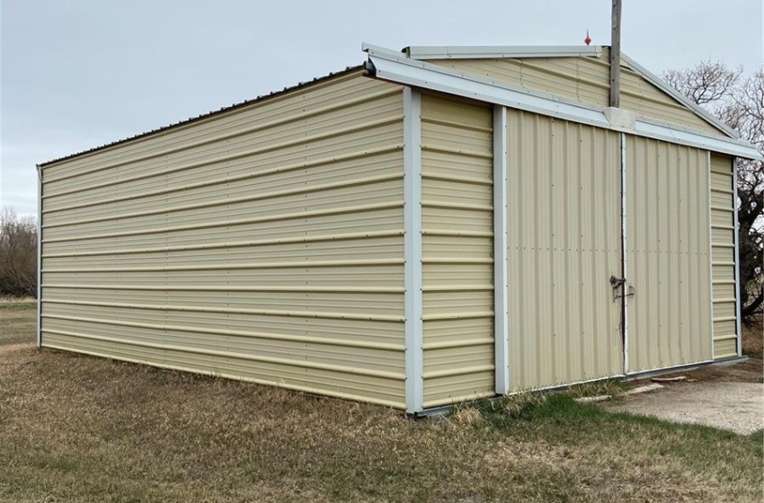 View of shed / structure with a lawn