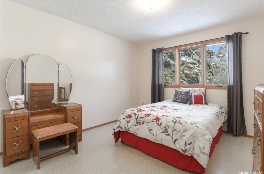 Bedroom featuring a textured ceiling