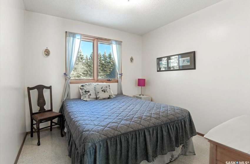 Bedroom featuring a textured ceiling