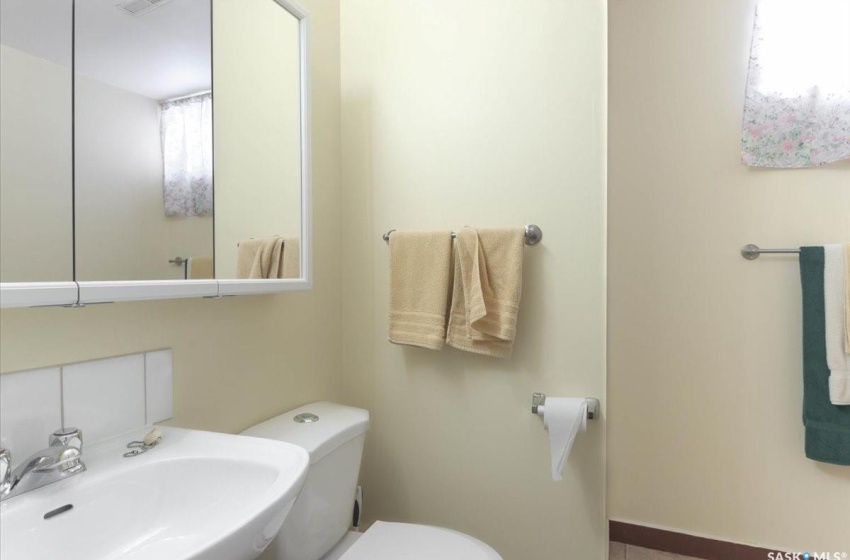 Bathroom with sink and toilet