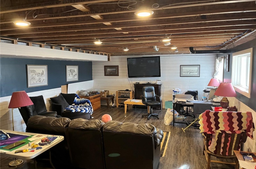 Living room with dark hardwood / wood-style floors