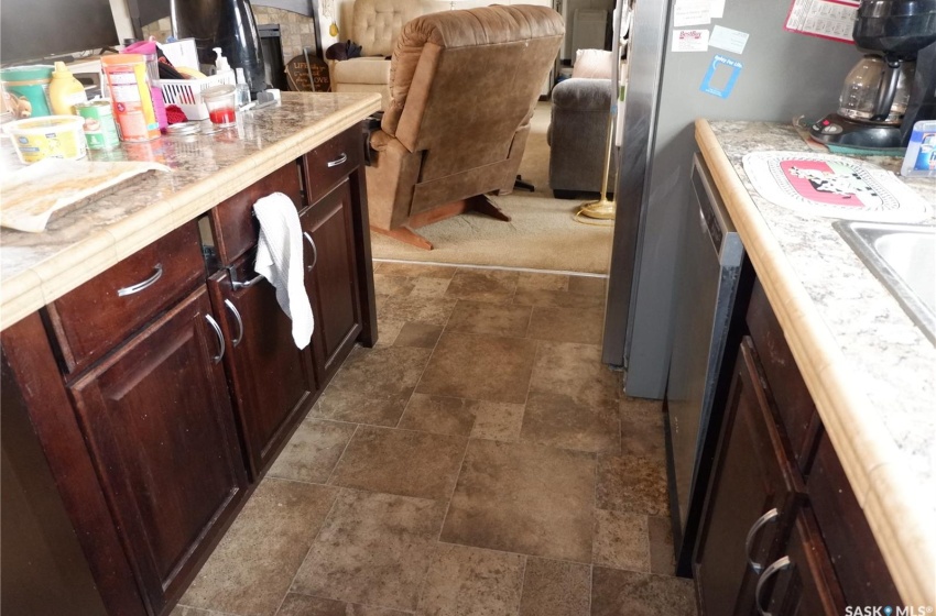 Kitchen featuring dark tile floors