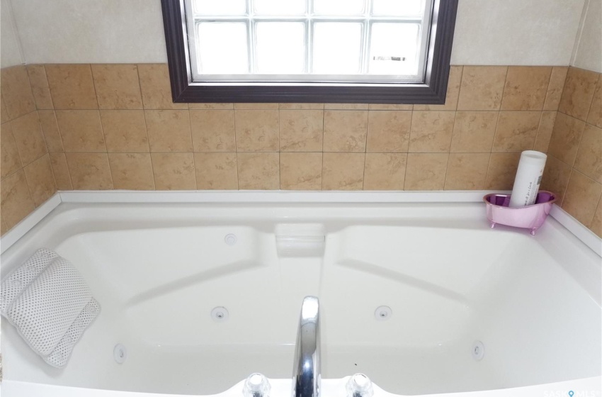 Bathroom with a Jetted bathing tub