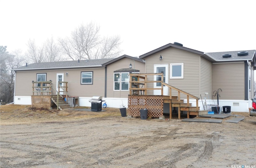 View of front of property featuring a wooden deck