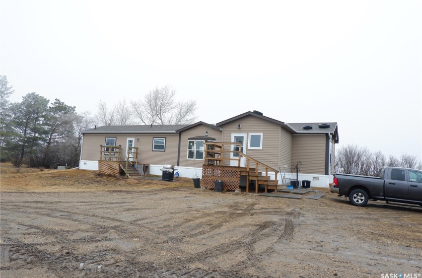 View of front of property with a wooden deck