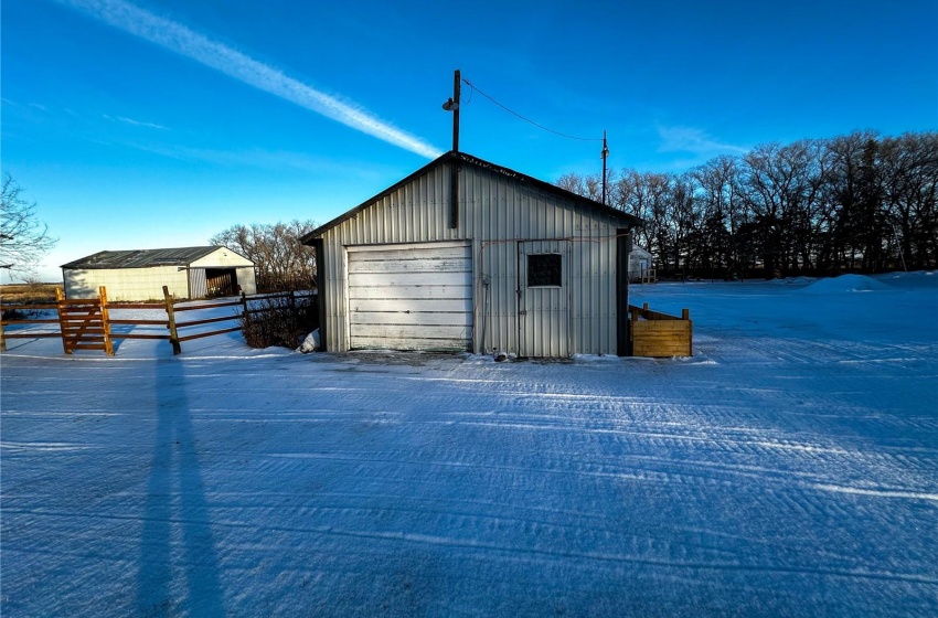 View of outdoor structure featuring a detached garage used as a shop