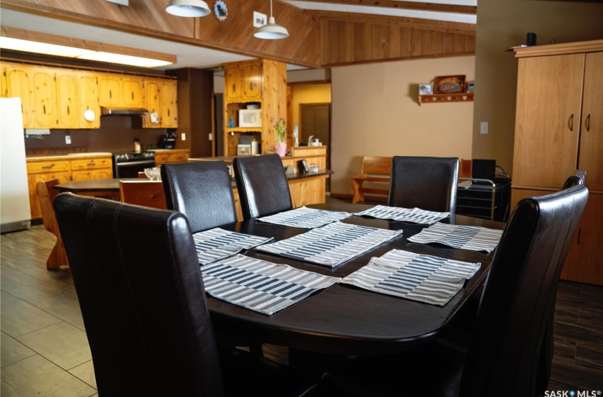 Dining space with hardwood / wood-style flooring