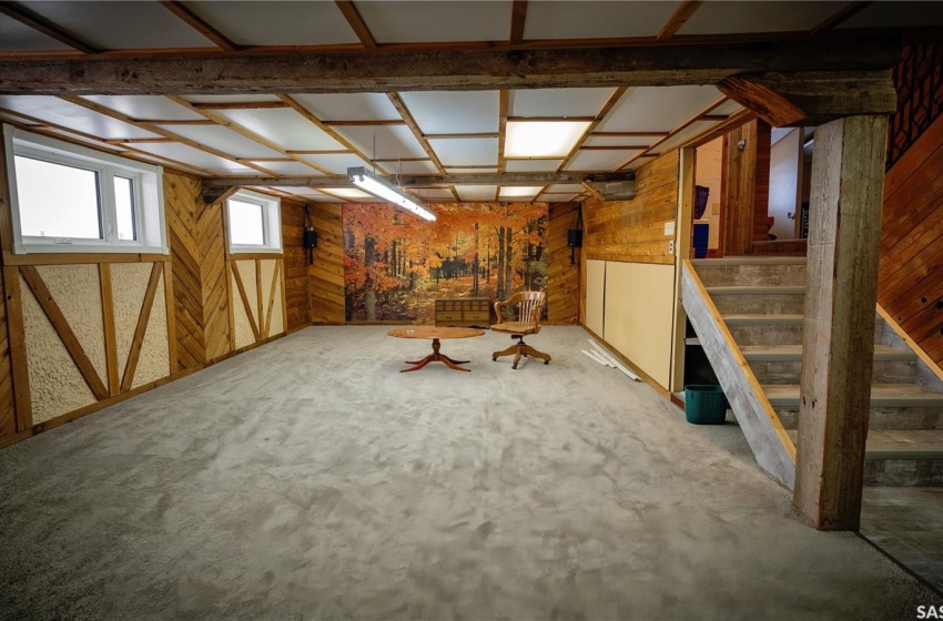 Basement featuring wooden walls