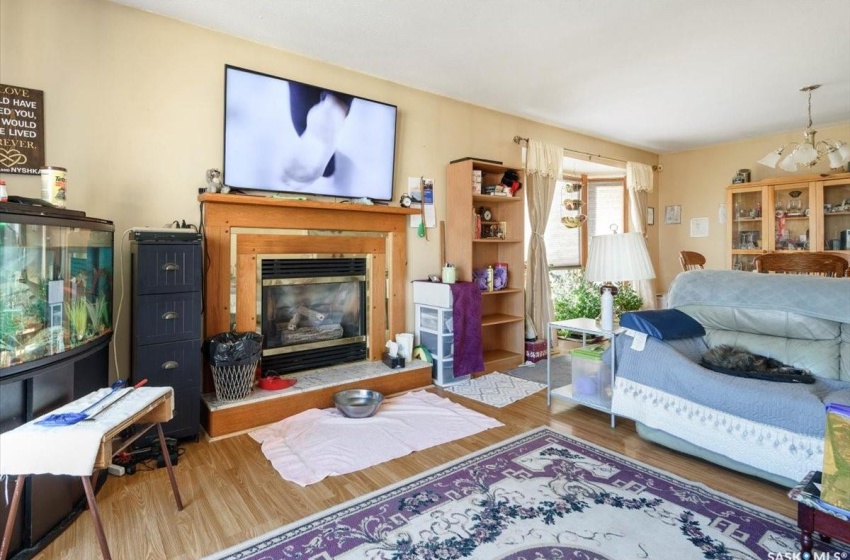 Living room featuring a chandelier and hardwood / wood-style flooring