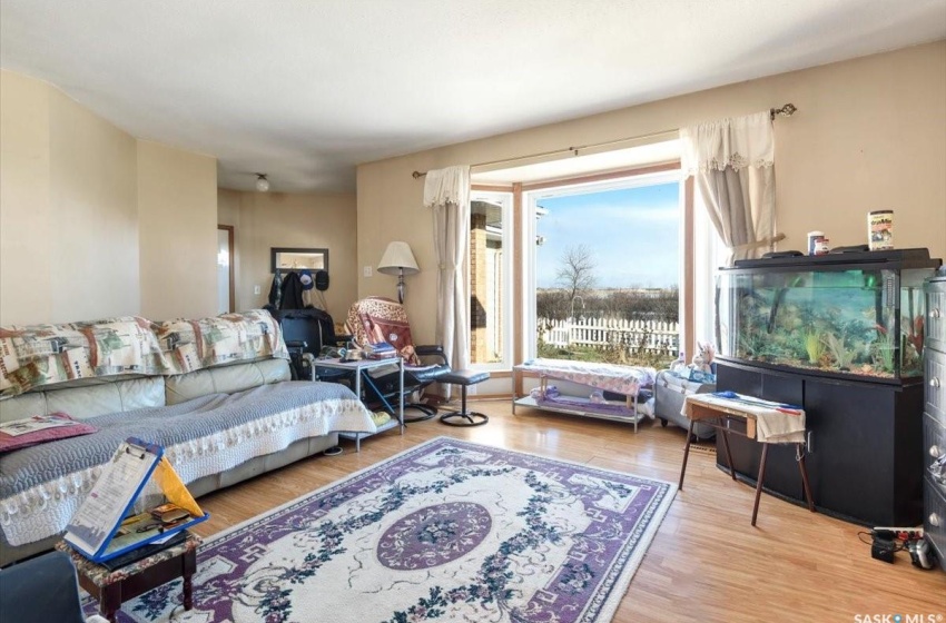 Living room with light hardwood / wood-style floors