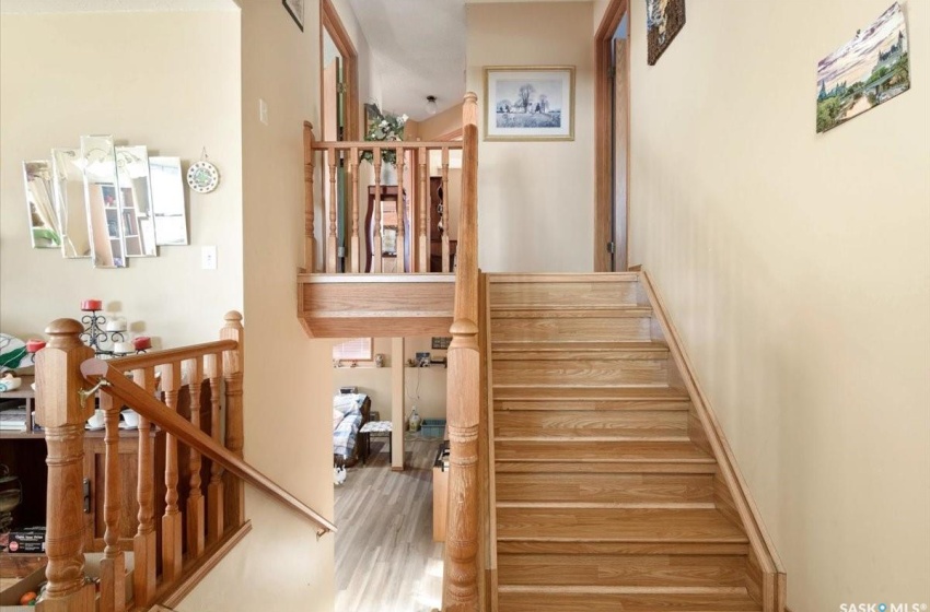 Stairs featuring light hardwood / wood-style floors