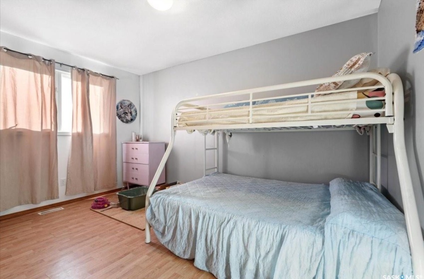 Bedroom with light hardwood / wood-style floors