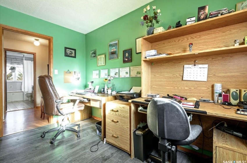 Office featuring a textured ceiling and hardwood / wood-style flooring