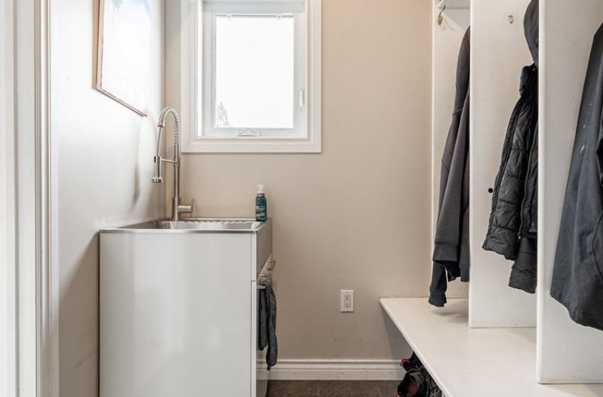 Mudroom featuring dark tile flooring