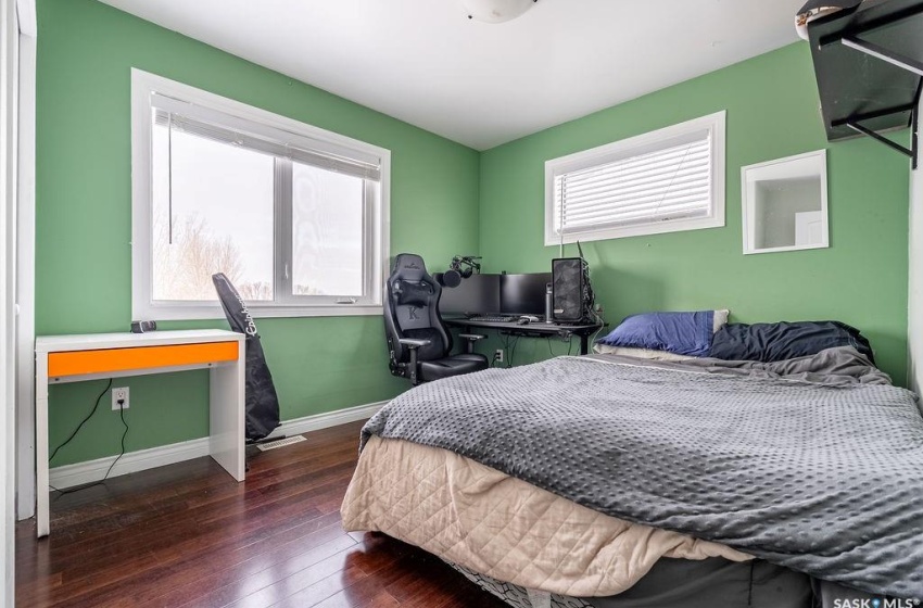 Bedroom featuring dark hardwood / wood-style flooring