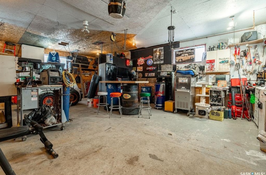 Garage featuring a workshop area and a garage door opener