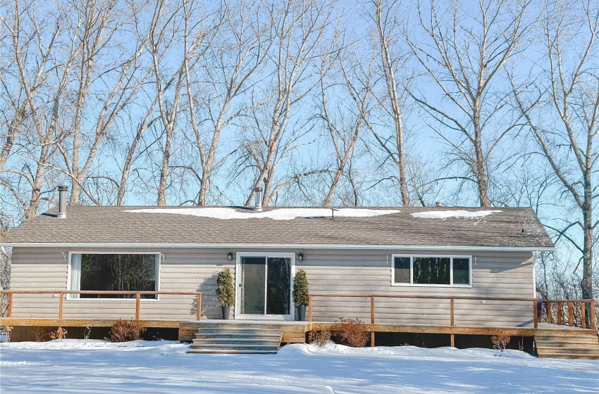 Ranch-style house featuring a wooden deck