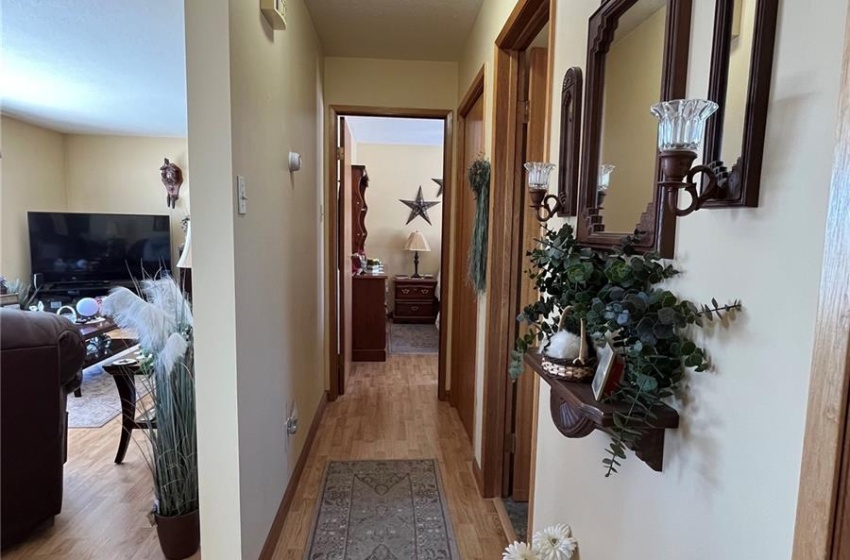 View of hallway to bedrooms, upper bath, and living room