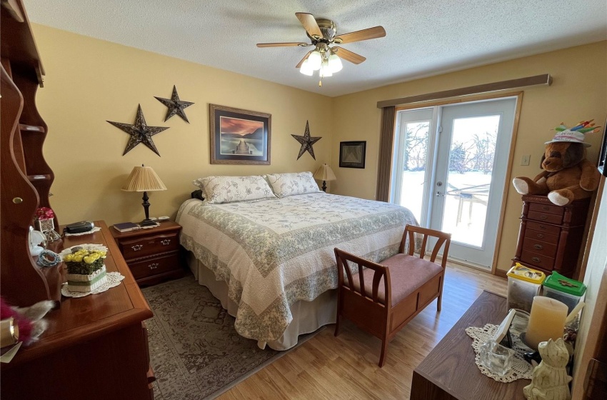 Master bedroom, featuring doors to back deck and hot tub