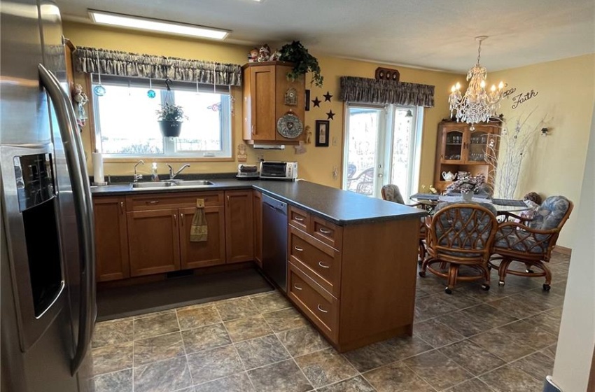 Kitchen with maple cupboards & stainless steel appliances