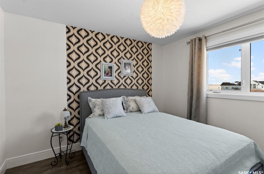 Bedroom featuring dark hardwood / wood-style flooring